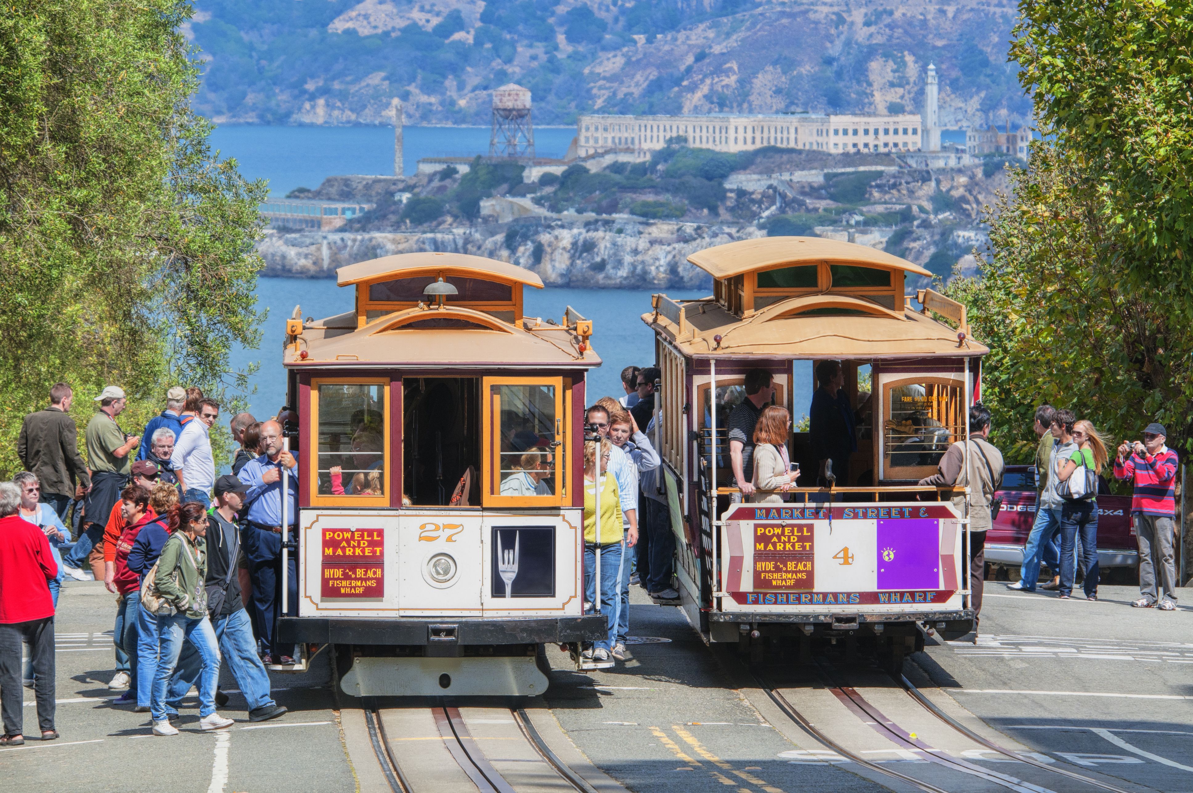 The San Francisco cable cars go up and down the San Francisco hills during the sunny month of September