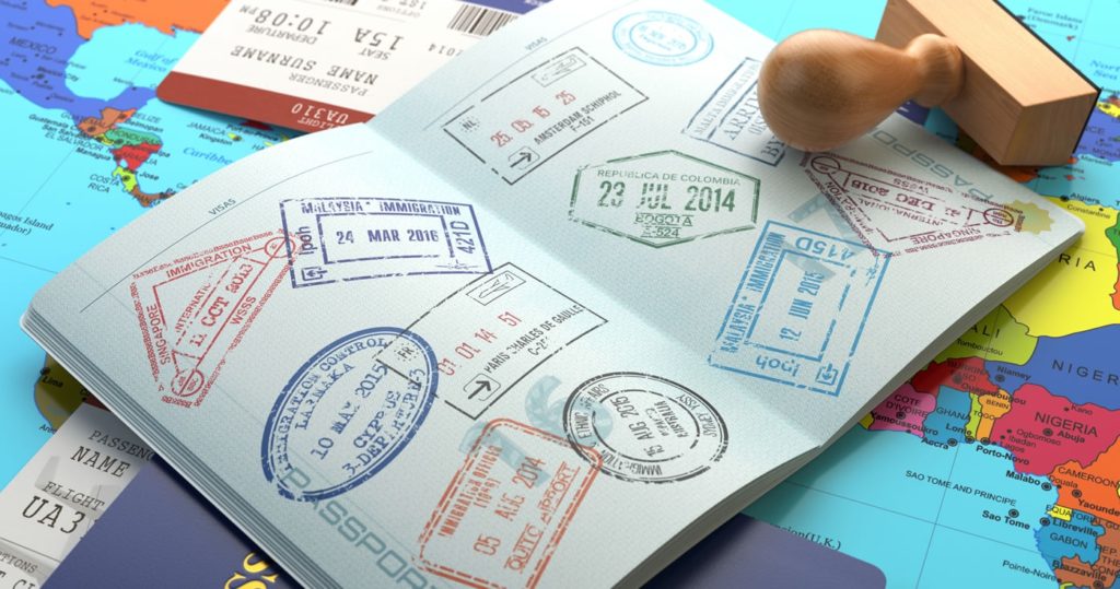 A passport with visa stamps all over the two pages displayed